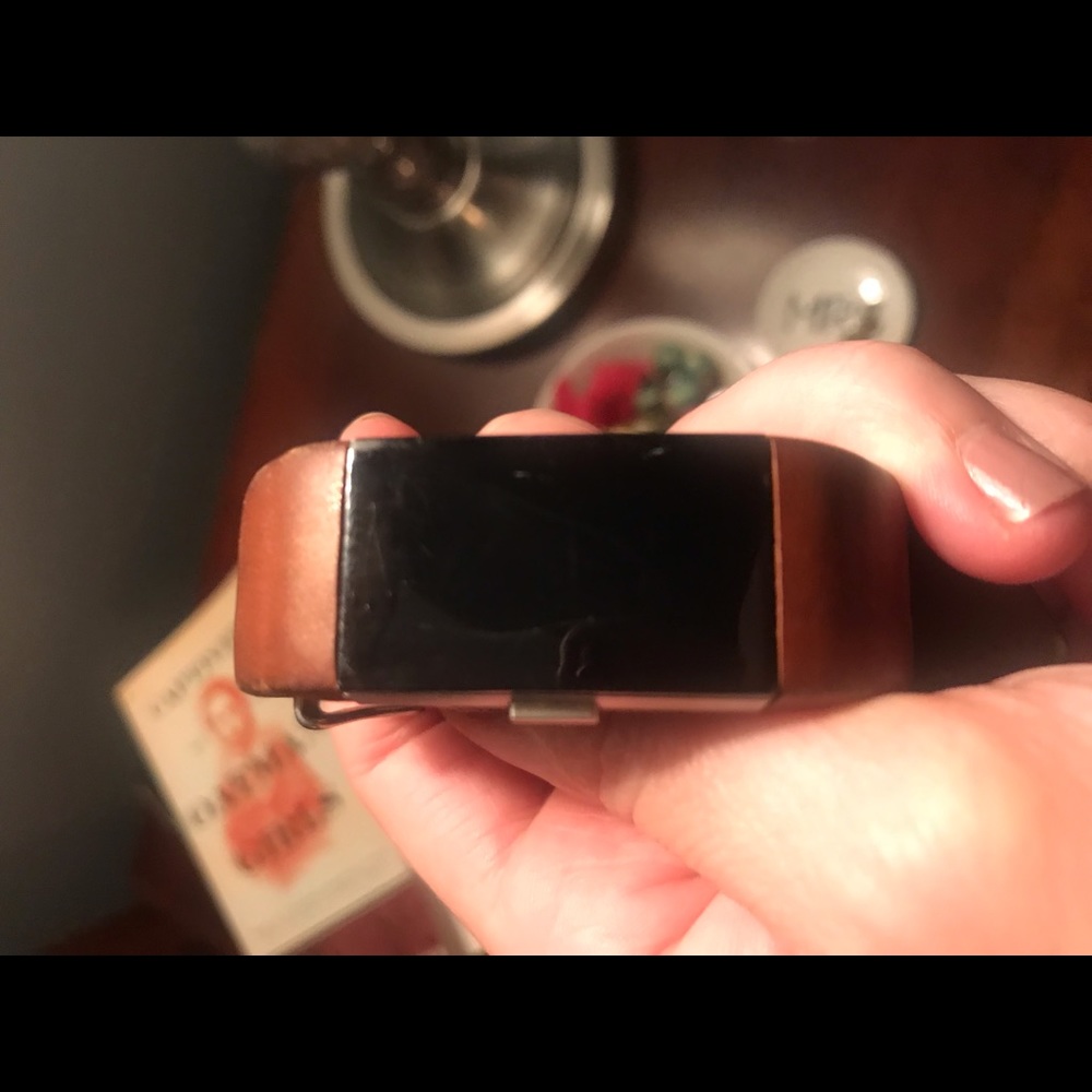 Fitbit charge. Works great. tiny scratch on face.